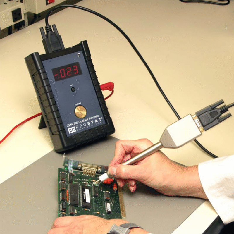 CVM-780-Contact-Voltmeter-1.png A technician measures voltage on a circuit board using a multimeter, ensuring proper functionality of the electronic components.