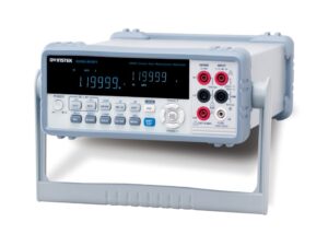 A digital multimeter displayed on a workbench, showcasing its essential features for measuring electrical values.