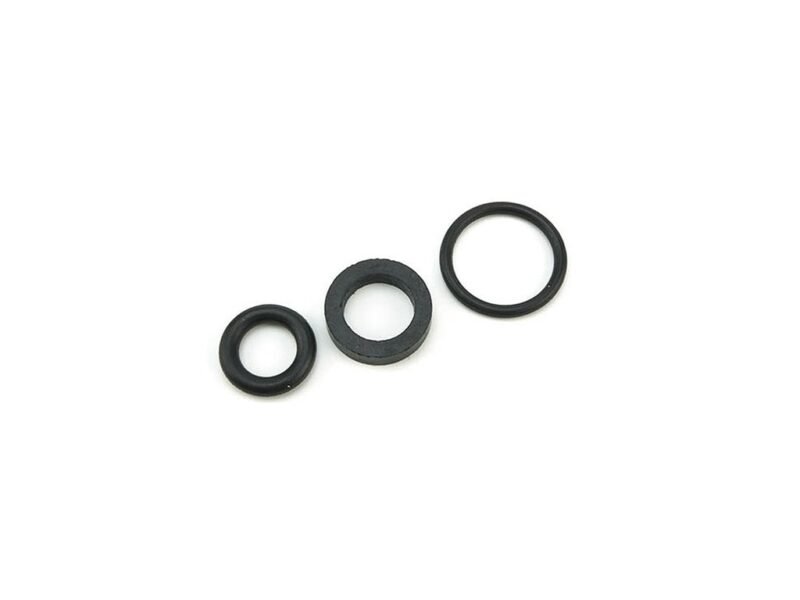 Yellow_19045.jpg A collection of black rubber washers and O-rings arranged neatly on a white background.